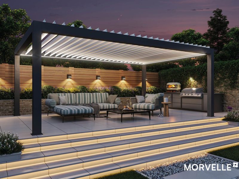 A pergola at night that is well lightened.