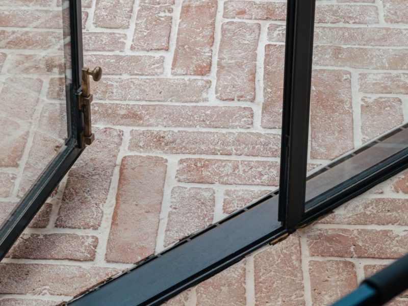 Heritage aluminium door being opened. 